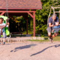 Day in the life of a family 4 children including 1 little girl with Down syndrome and autism and her adopted little brother, Down syndrome and autism too, a big brother and a baby boy. They take a walk in the forest and play in a public park. Photo was taken in Quebec Canada.