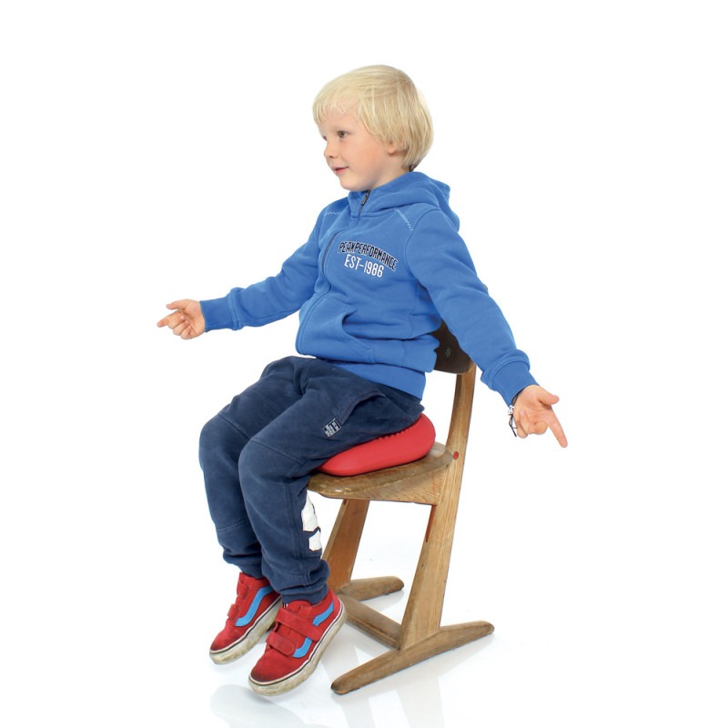 Enfant assis sur un coussin Dynair Premium